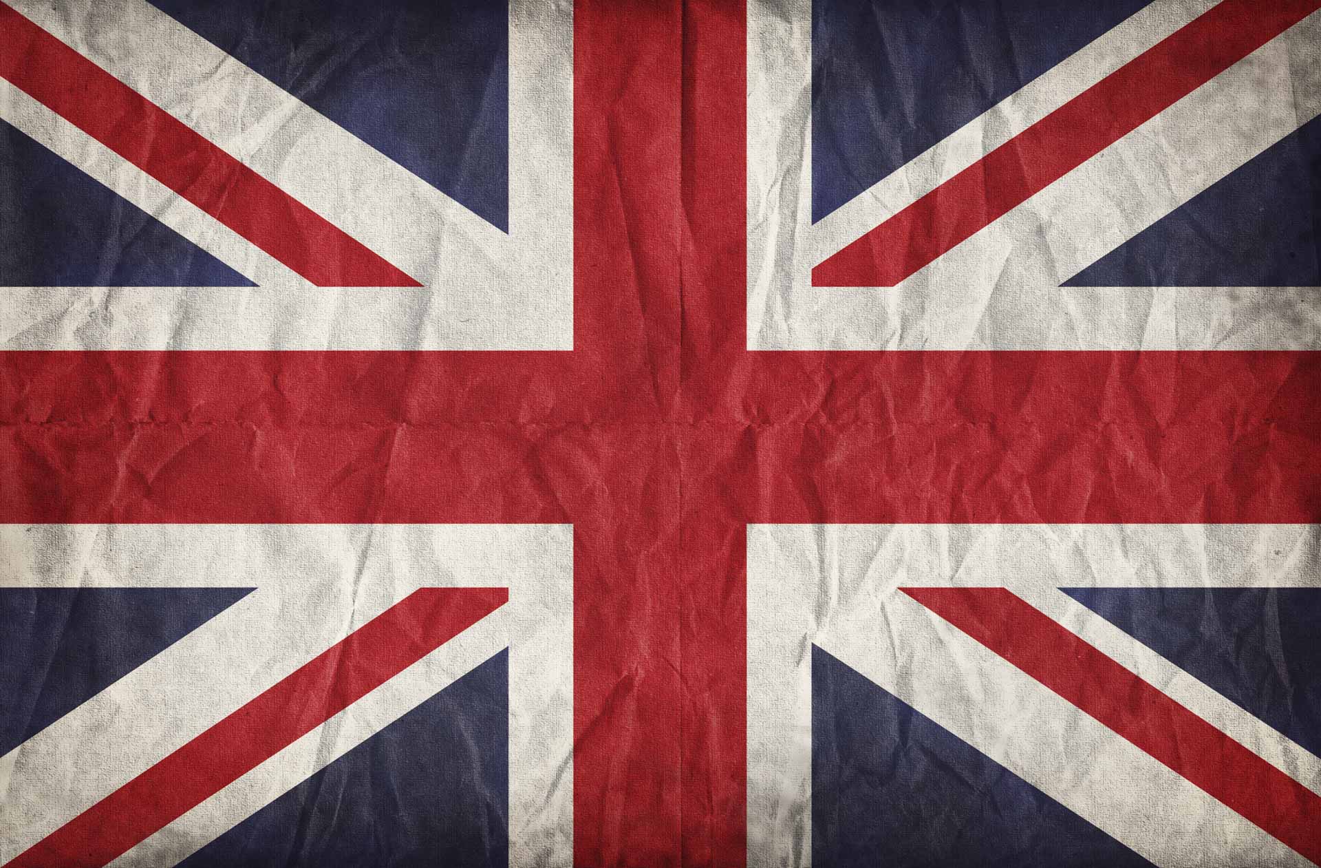 Union Jack on crumpled paper background. Vintage effect