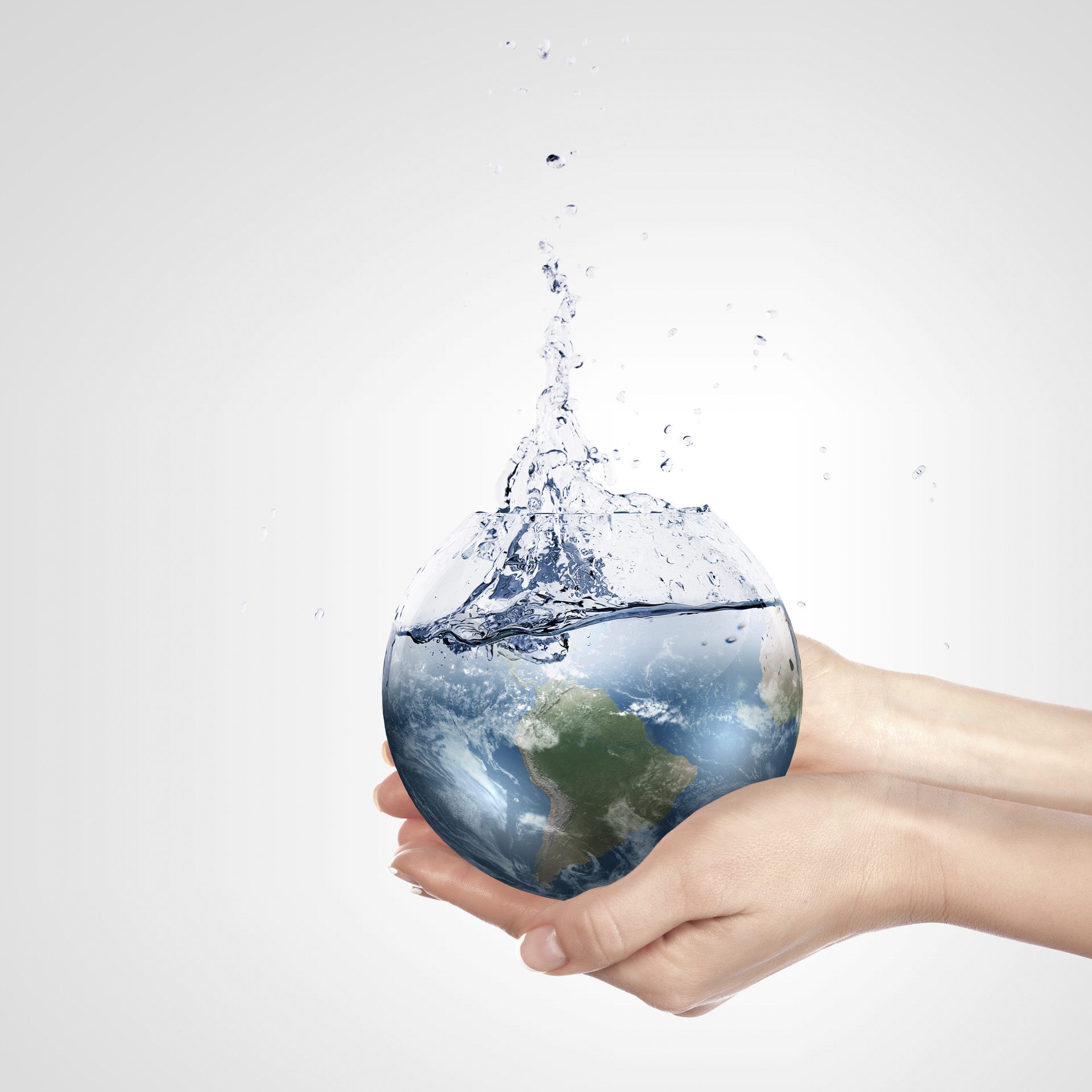 Globe in human hand against blue sky. Environmental protection concept. Elements of this image furnished by NASA