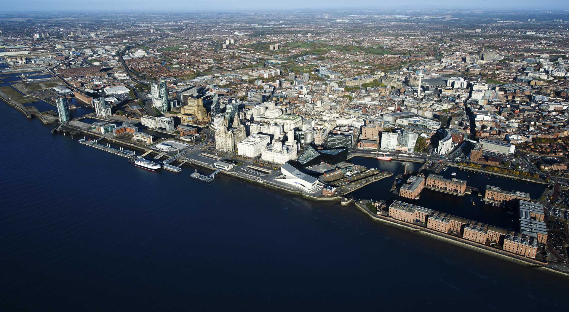 Dramatic aerial view of Liverpool with Mersey river in foreground