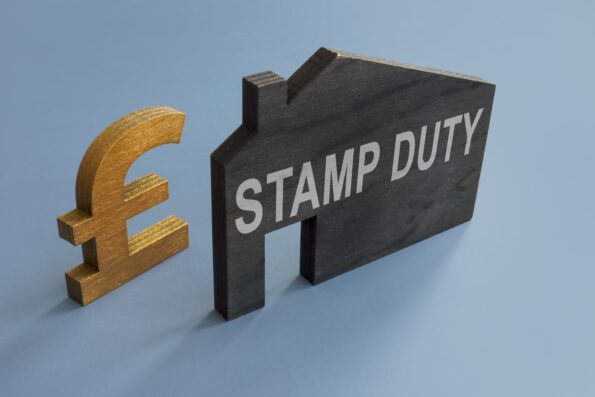 House model with inscription Stamp duty and sign of pound.