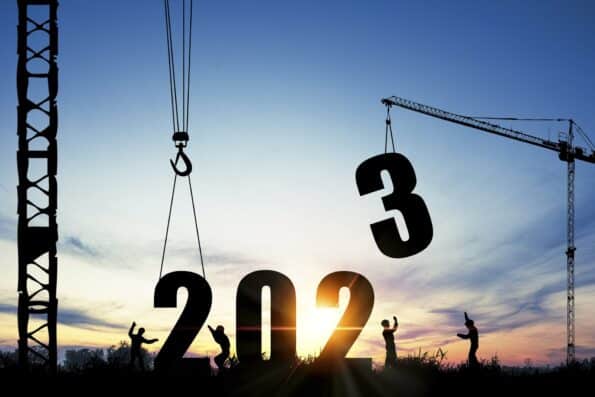 Silhouette of construction worker with crane and cloudy sky for preparation of welcome 2023 new year party and change new business.