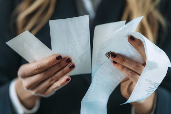 Woman looking at receipts and bills representing inflation worries