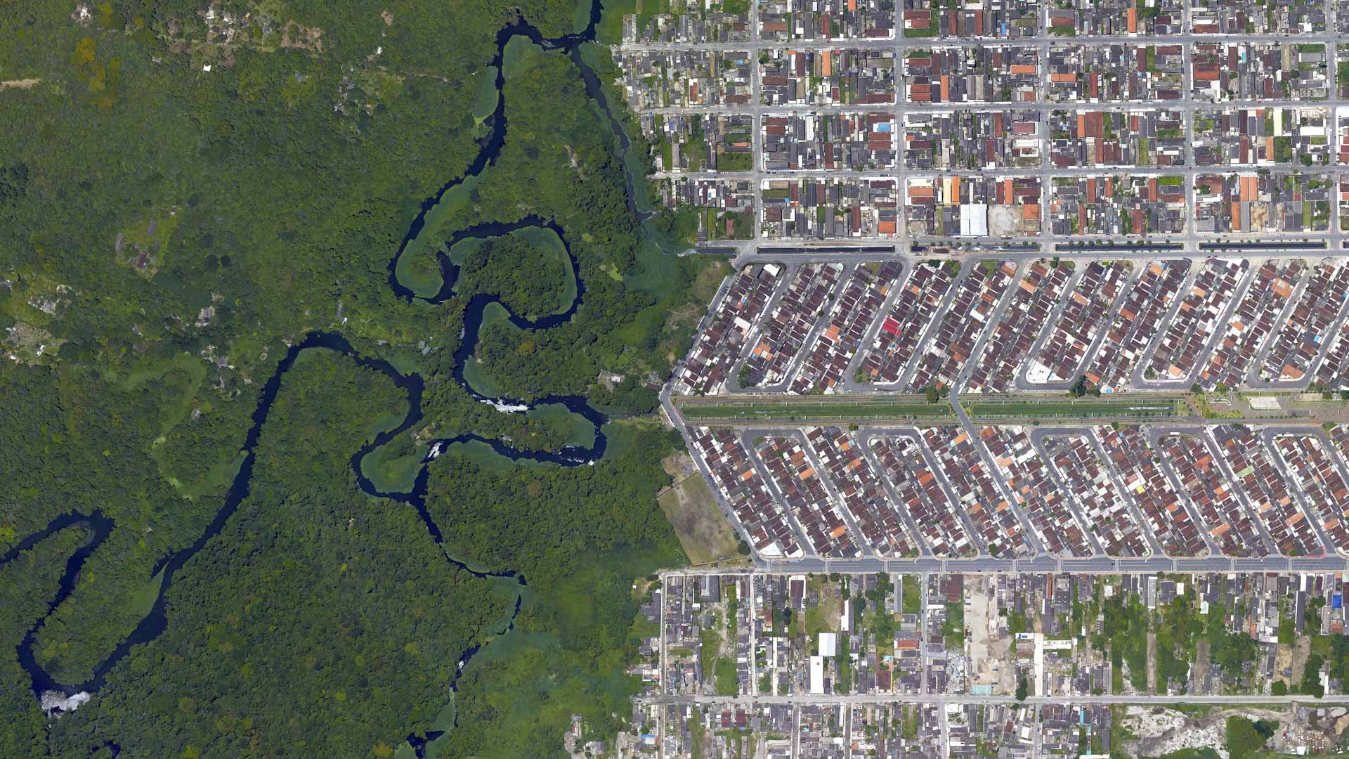 Forest, river and city border, forest and city separated by zigzag line, looking down aerial view from above – Bird’s eye view forest and city border Vila Caiçara, Praia Grande - Sao Paulo, Brazil