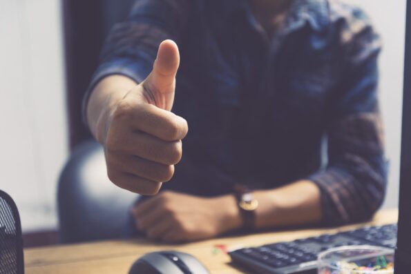 Businessman showing thumbs up - closeup shot