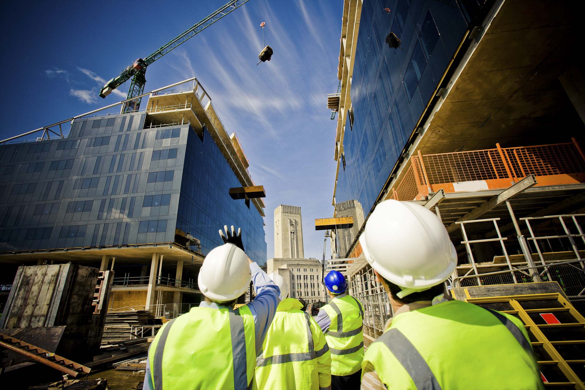 Workers looking at a new development site