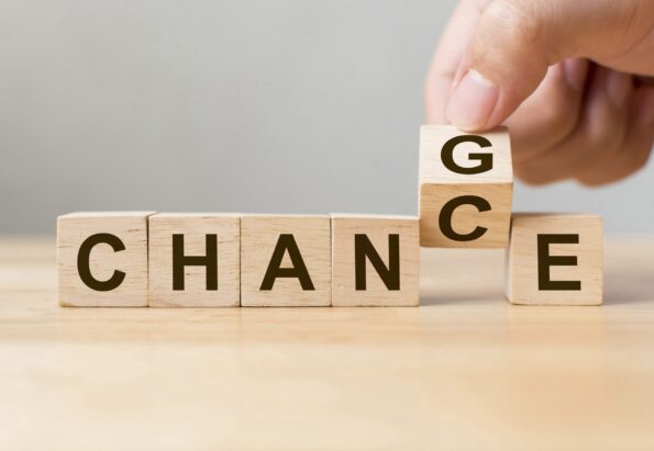 Hand flip wooden cube with word change to chance, Personal development and career growth or change yourself concept