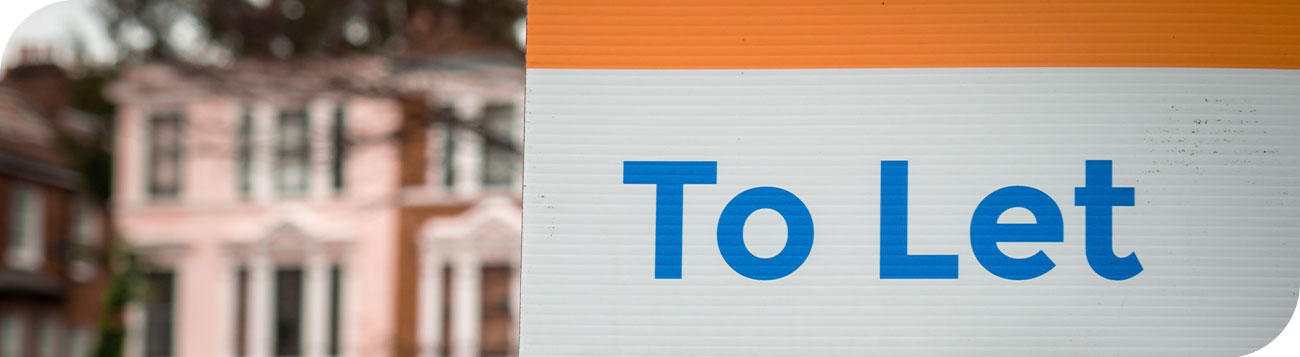 Text 'To Let' on a sign