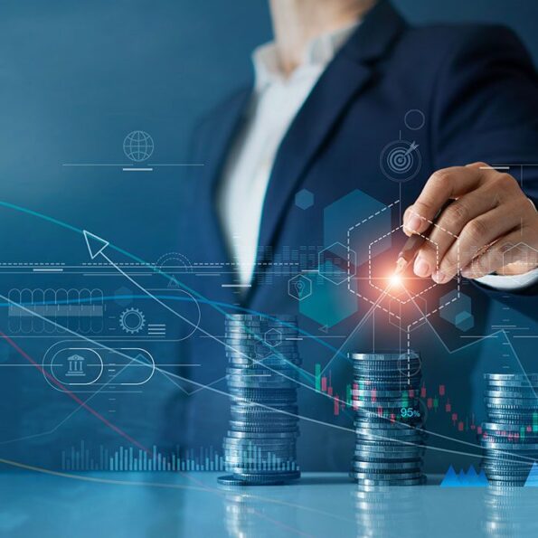 Man pointing at hologram behind piles of coin