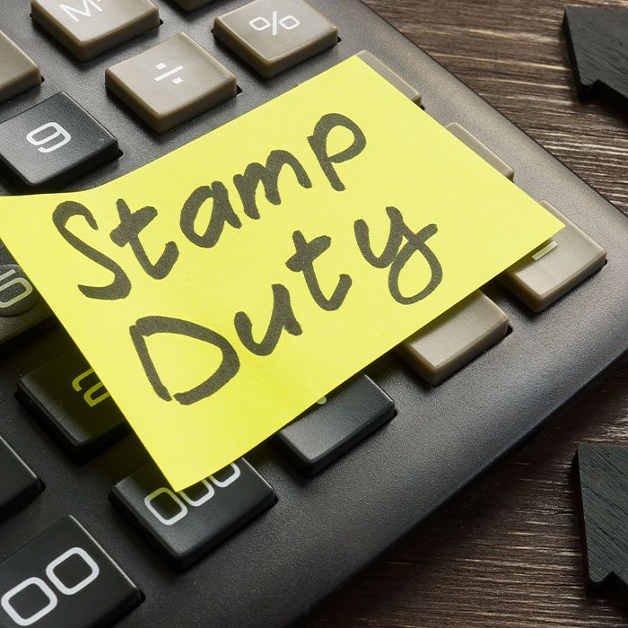 Stamp Duty sticky note on a key borad