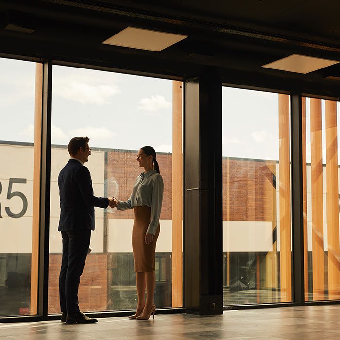 Two-people-shaking-hands-investor-landlord