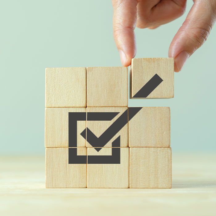 Wooden blocks and a ticked box