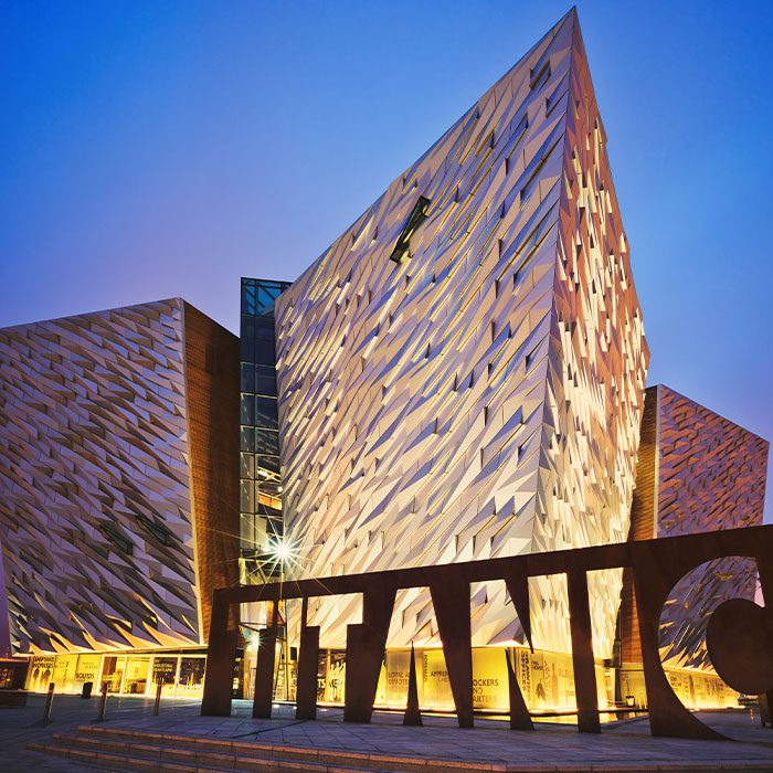 BELFAST, NORTHERN IRELAND - JUNE 28, 2017: Sunset over Titanic Belfast - museum, touristic attraction and monument to Belfast's maritime heritage on the site of the former Harland and Wolff shipyard.