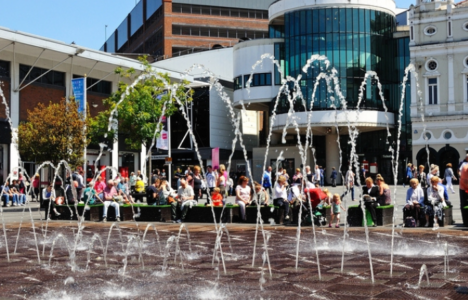 The Playhouse Theatre in Williamson Square with fountains in the foreground.