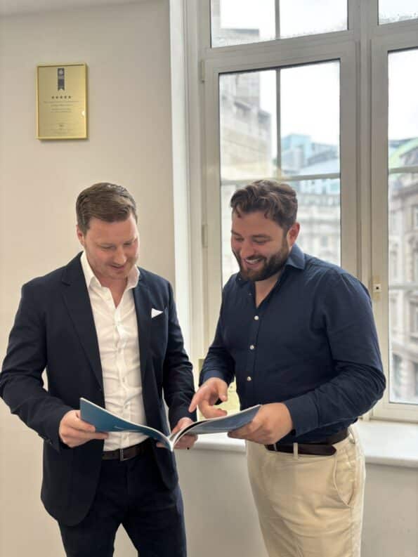RWinvest sales team members talking in office
