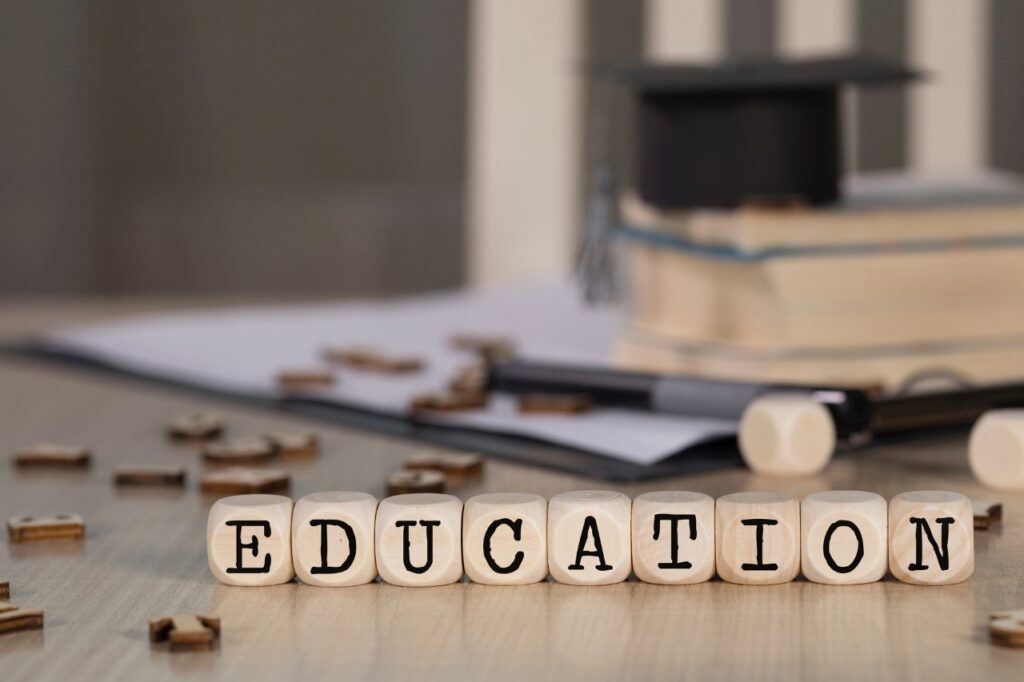 Word EDUCATION composed of wooden dices