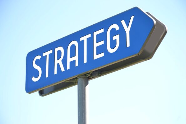 word strategy on blue street sign