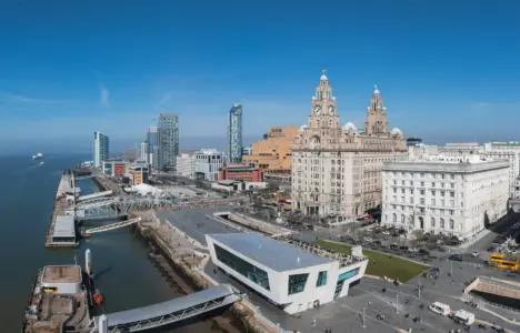 Liverpool Waterfront buildings with blue sky and river mersey