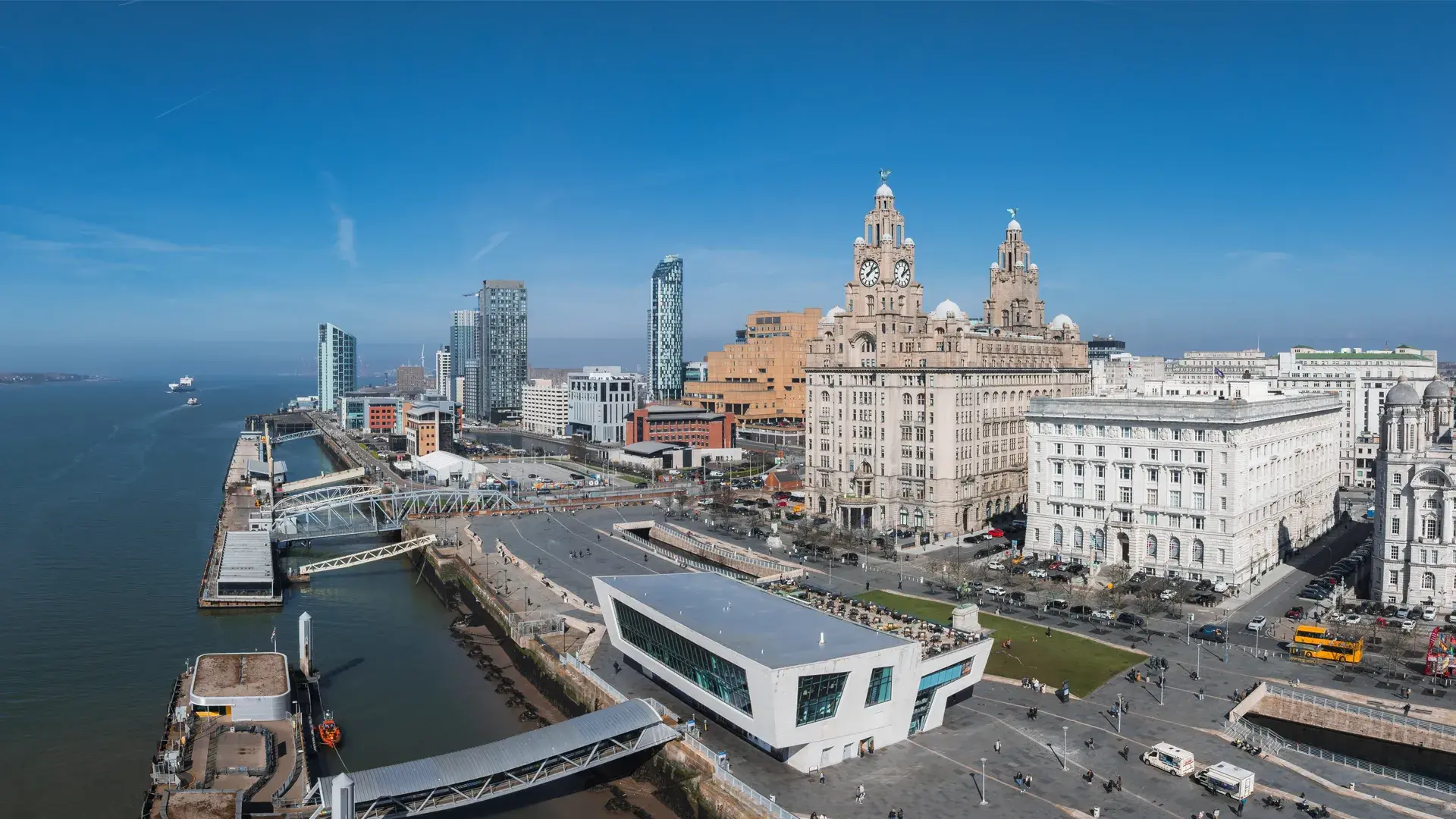 Liverpool Waterfront buildings with blue sky and river mersey
